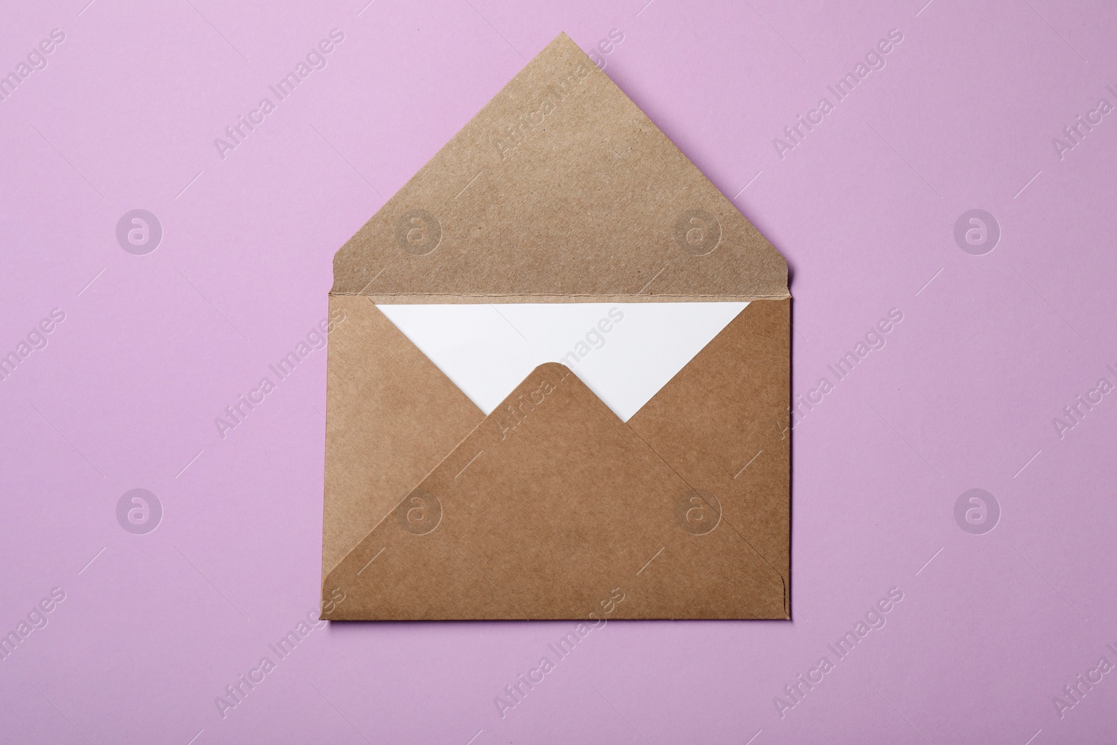 Photo of Letter envelope with card on violet background, top view