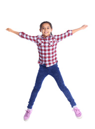 Photo of Cute little girl jumping on white background