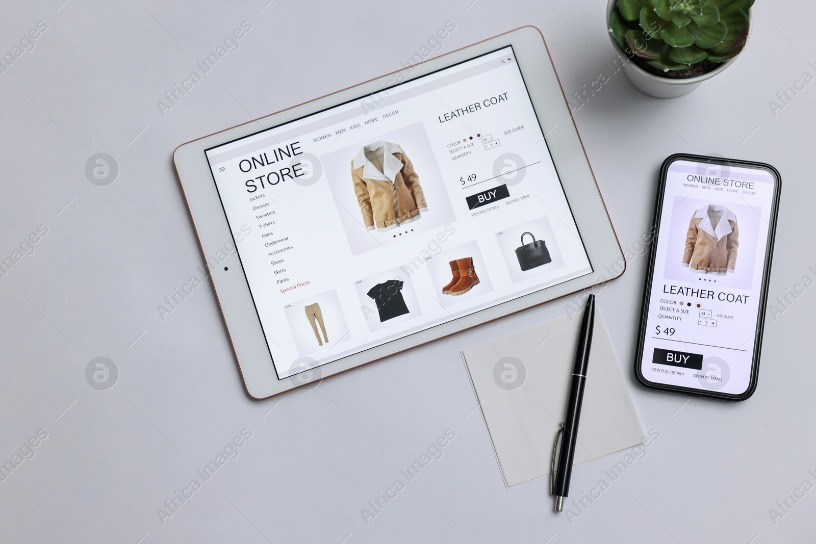 Photo of Online shopping. Flat lay composition with modern tablet and smartphone on white background