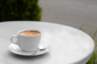 Ceramic cup of aromatic coffee on table in morning, space for text