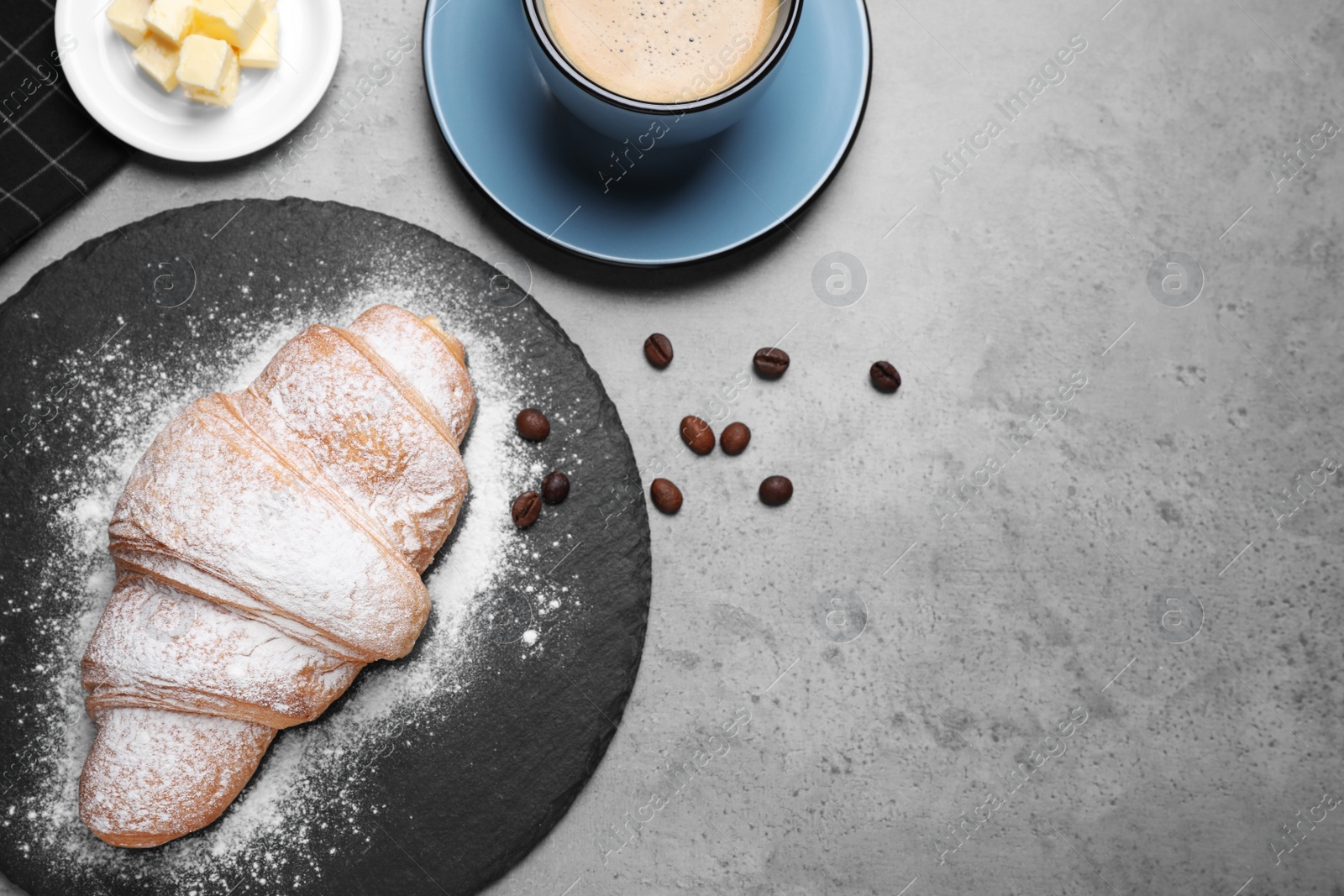 Photo of Flat lay composition with tasty croissant on grey table, space for text