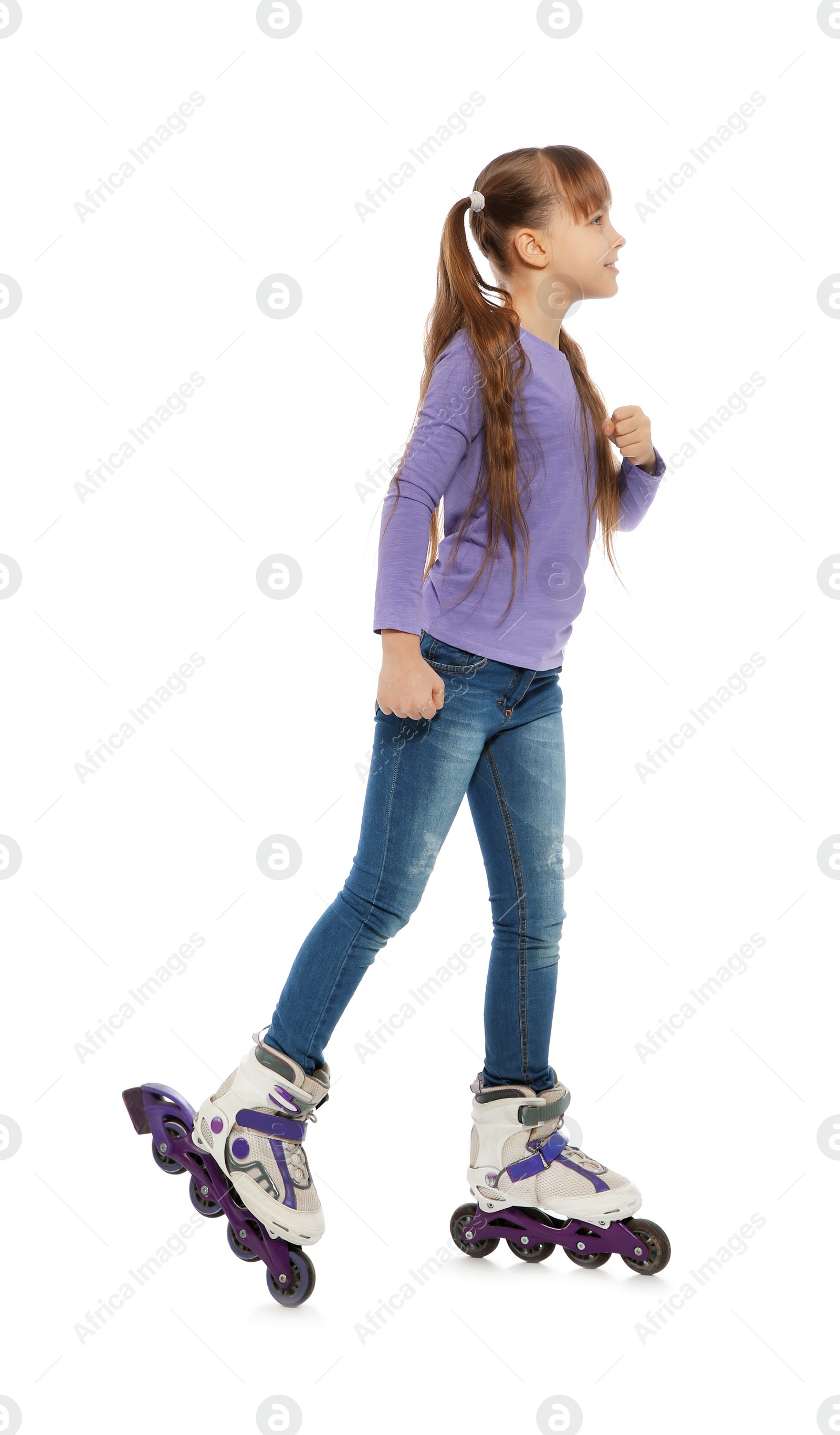 Photo of Little girl with inline roller skates on white background