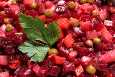 Photo of Delicious fresh vinaigrette salad with parsley as background, closeup