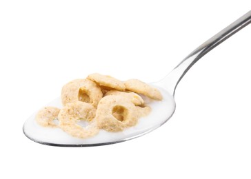 Photo of Cereal rings and milk in spoon isolated on white