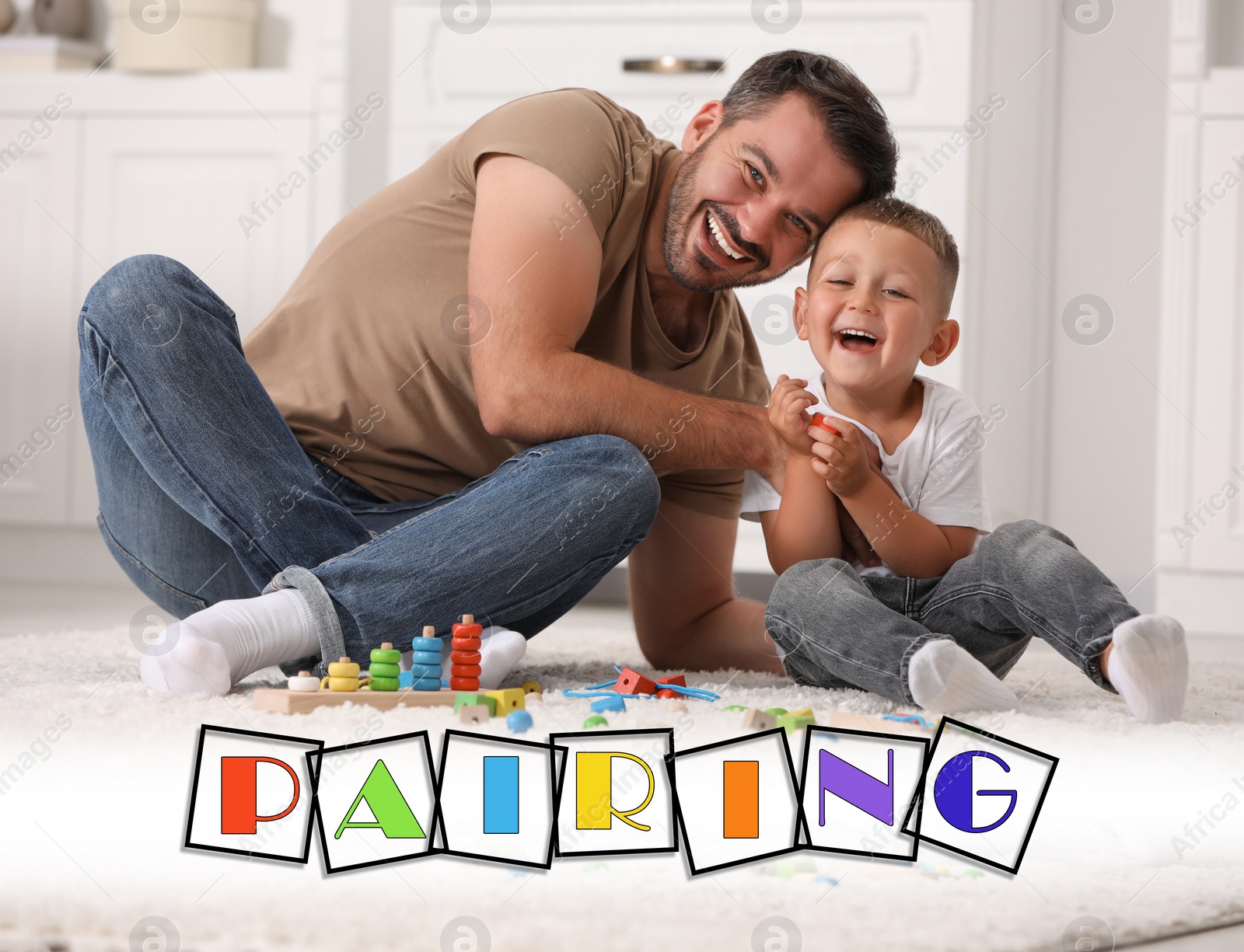Image of Pairing. Father and his son playing together on floor indoors