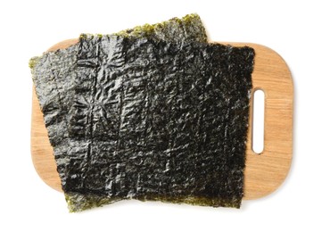 Photo of Dry nori sheets and wooden board on white background, top view