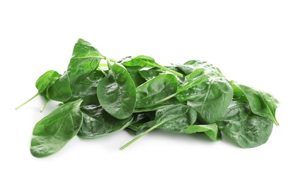 Heap of fresh green healthy baby spinach leaves isolated on white