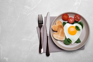 Romantic breakfast on light grey table, flat lay with space for text. Valentine's day celebration