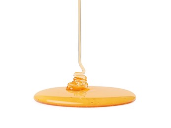 Photo of Pouring tasty natural honey isolated on white