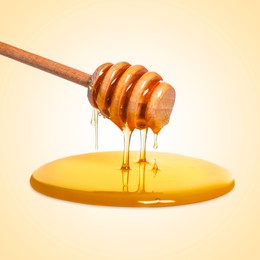 Image of Natural honey dripping from dipper on beige background