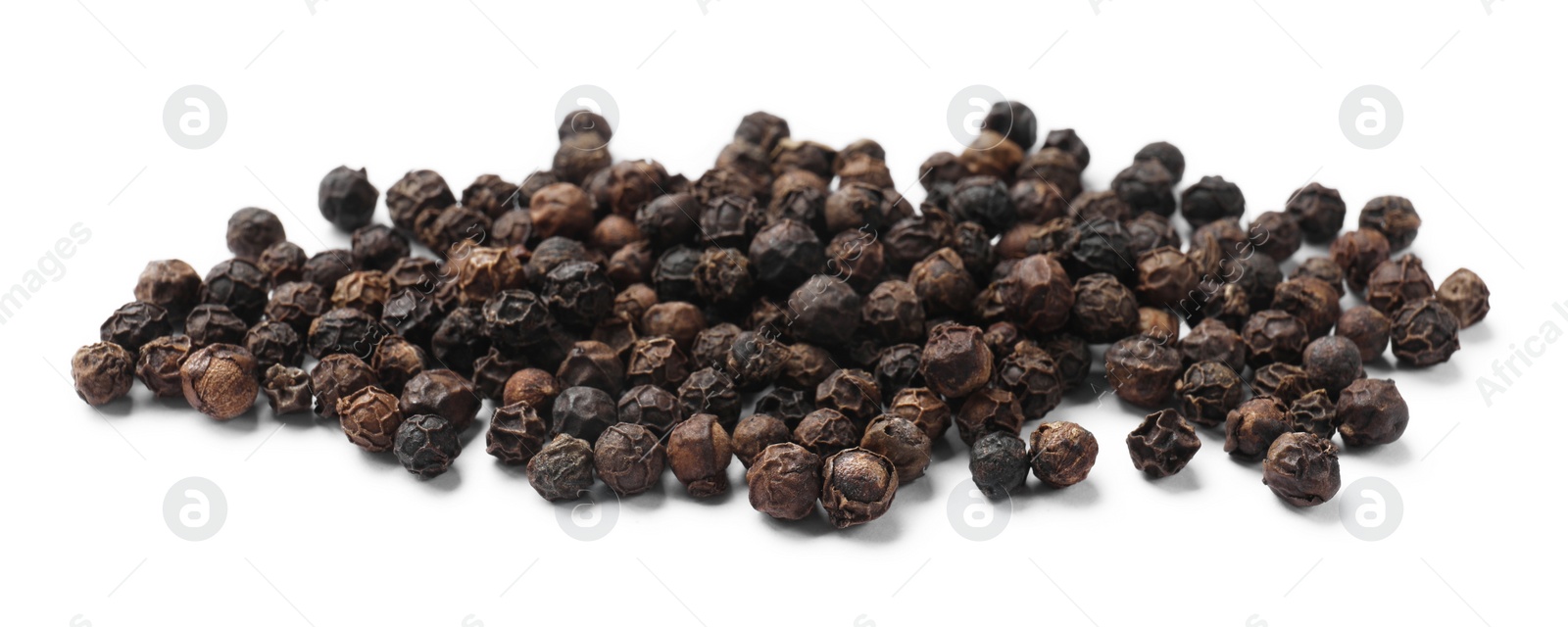 Photo of Aromatic spice. Many black dry peppercorns isolated on white