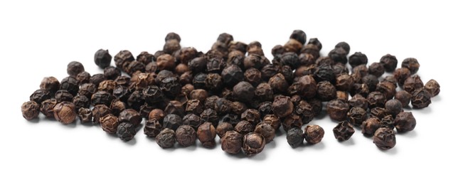 Aromatic spice. Many black dry peppercorns isolated on white