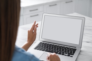 Photo of Coworkers working together online. Young woman using video chat on laptop, closeup