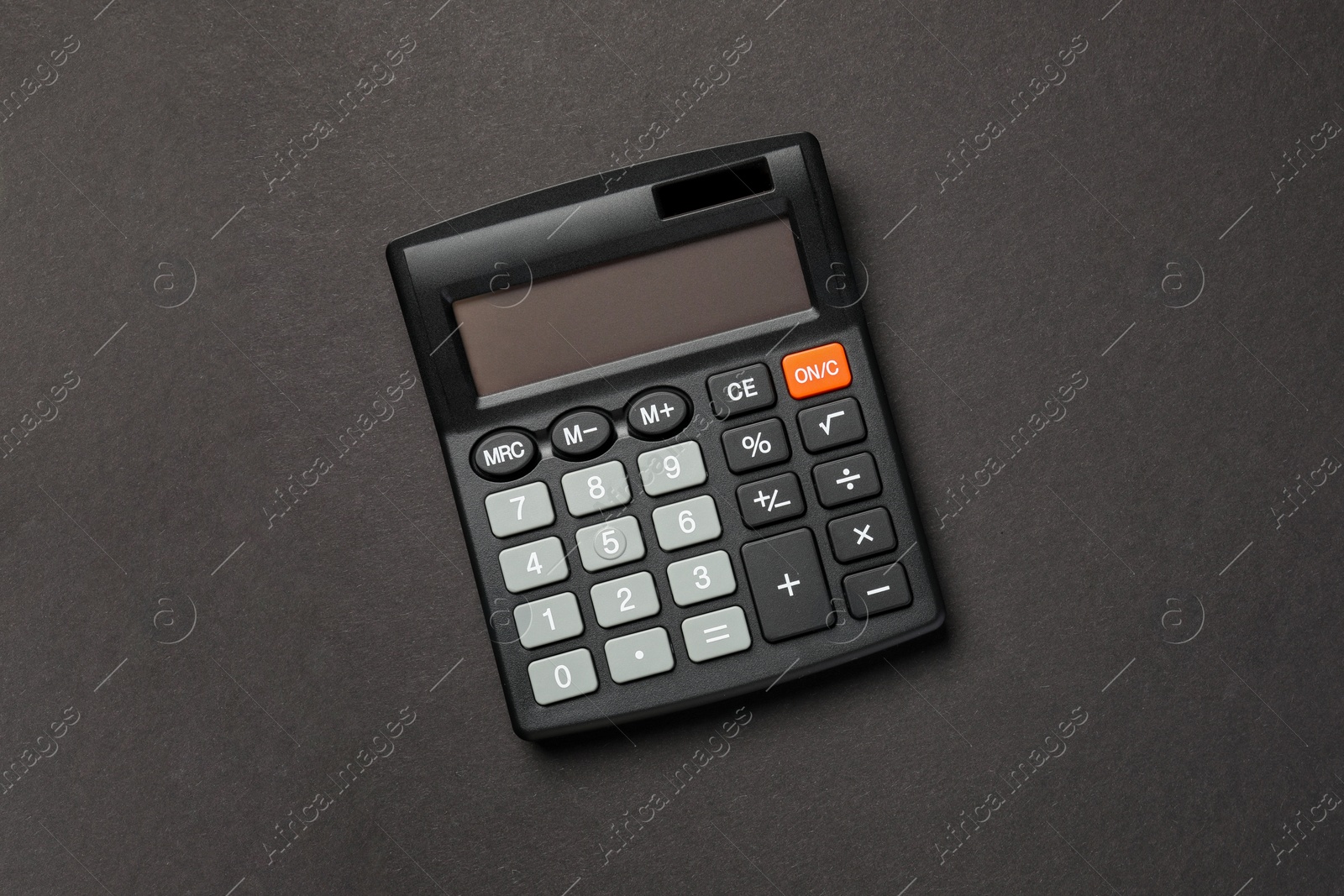 Photo of Calculator on black background, top view. Space for text