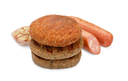 Photo of Delicious vegan cutlets, sausages and garlic isolated on white