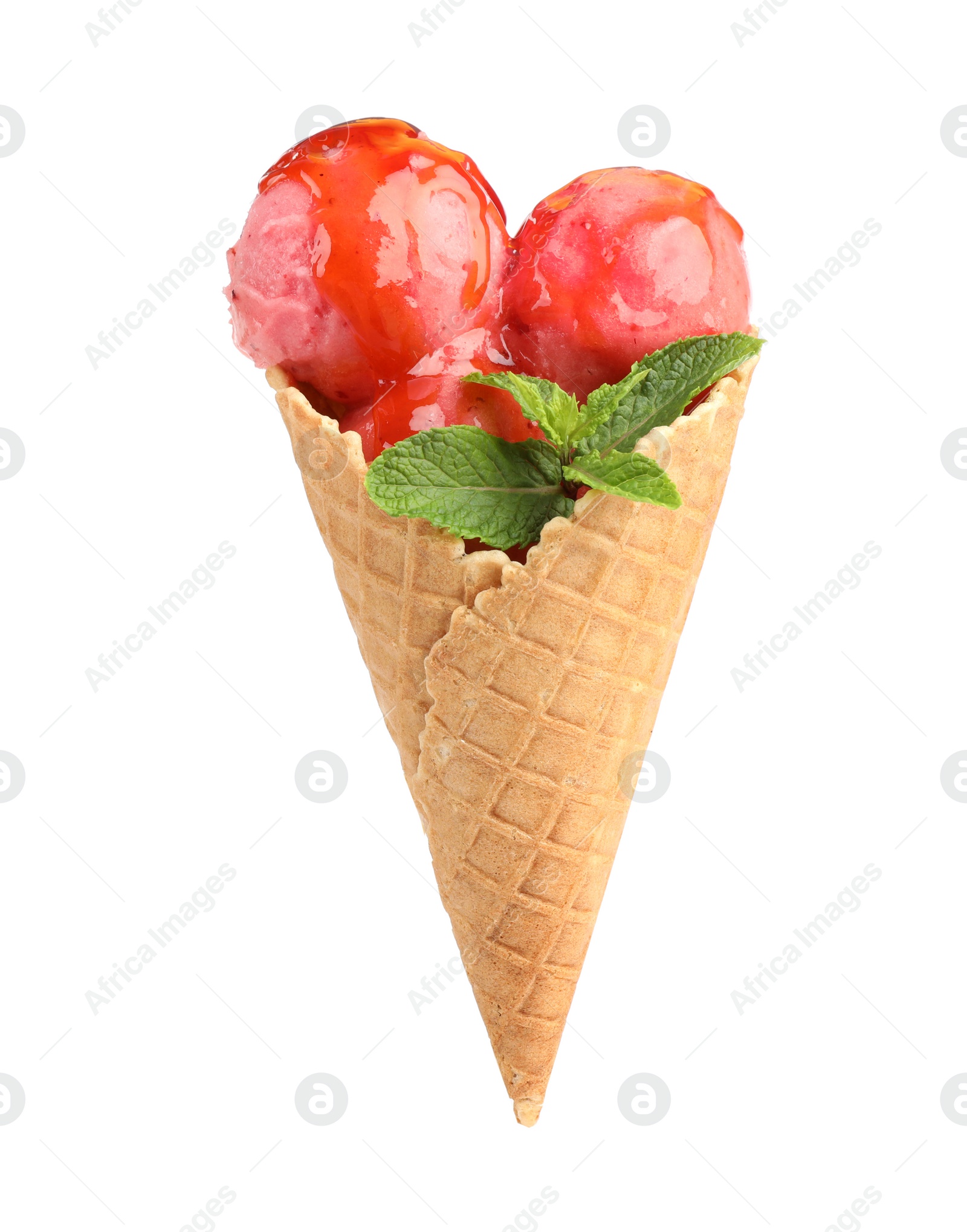 Photo of Delicious pink ice cream with mint and syrup in waffle cone on white background