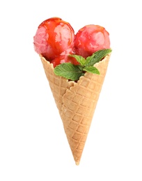 Photo of Delicious pink ice cream with mint and syrup in waffle cone on white background