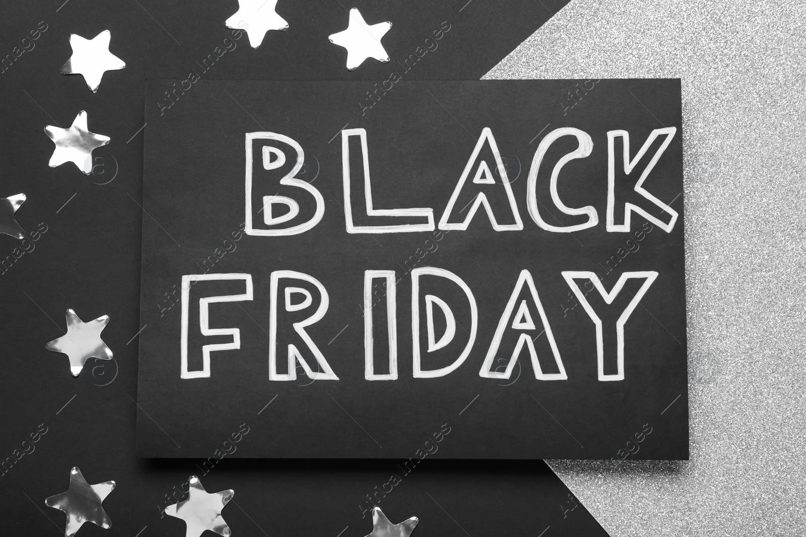Photo of Card with words Black Friday and confetti on color background, flat lay