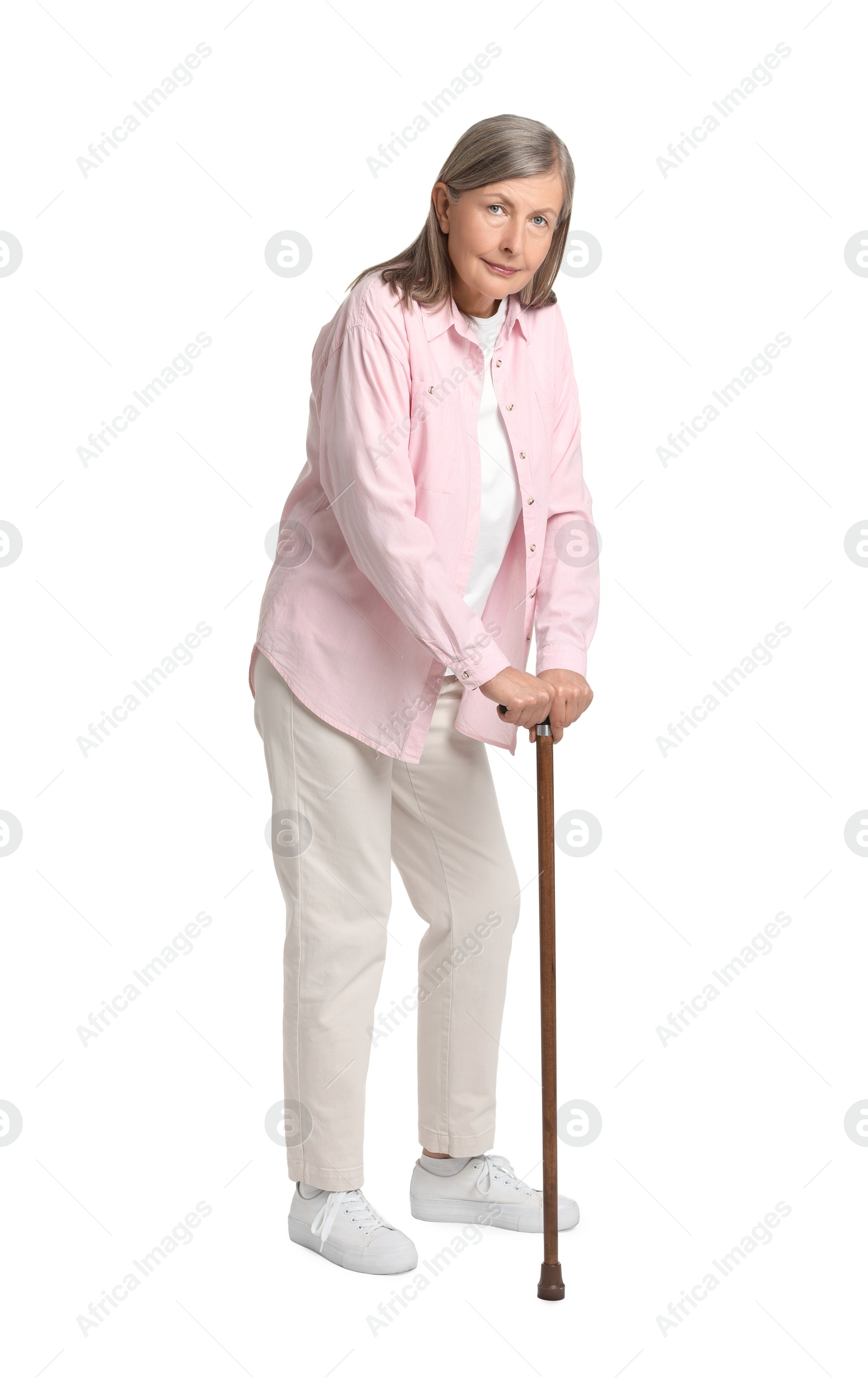 Photo of Senior woman with walking cane on white background