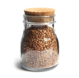 Jar with uncooked buckwheat on white background