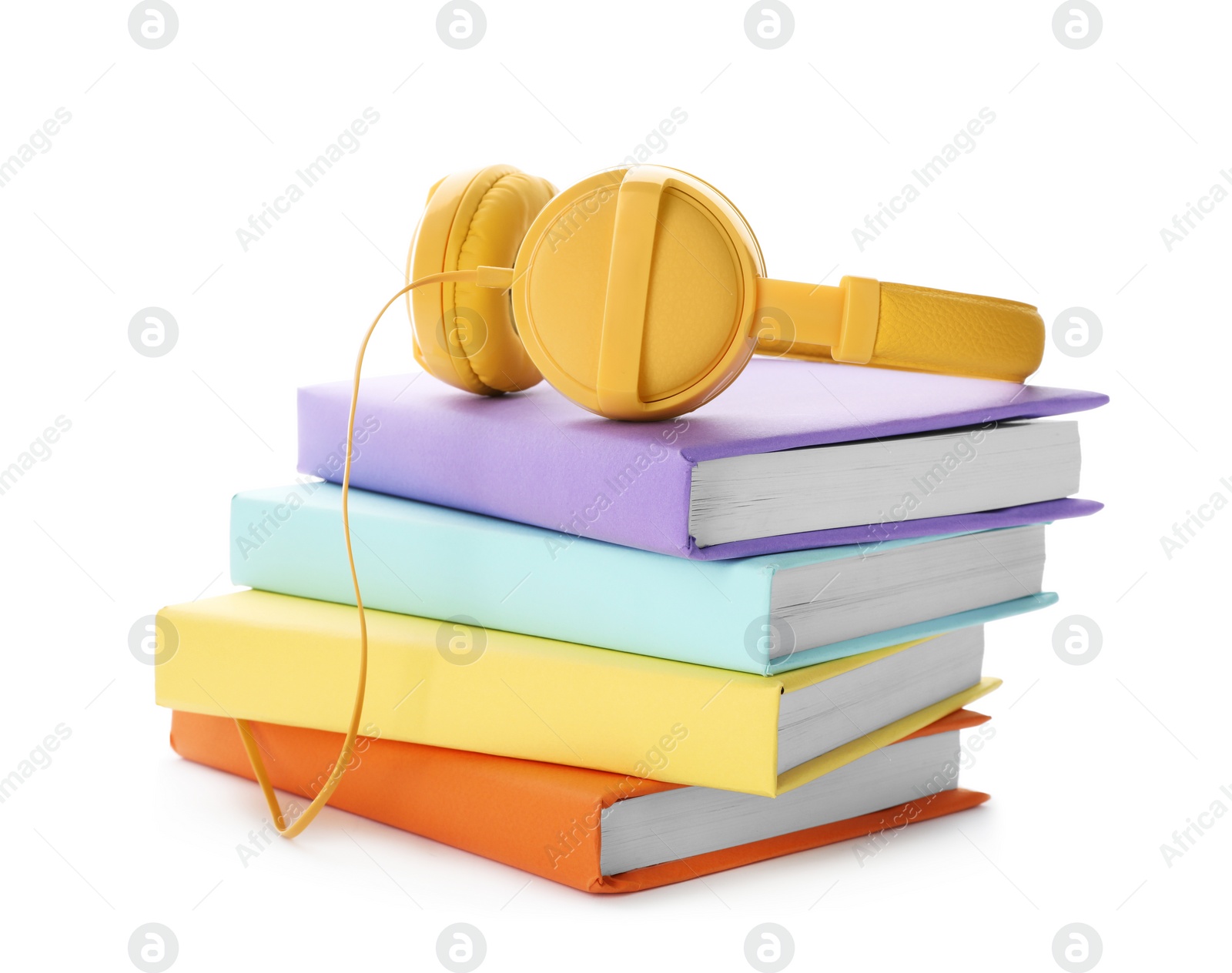 Photo of Modern headphones with hardcover books on white background