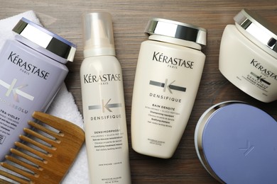 MYKOLAIV, UKRAINE - SEPTEMBER 07, 2021: Flat lay composition with Kerastase hair care cosmetic products on wooden table