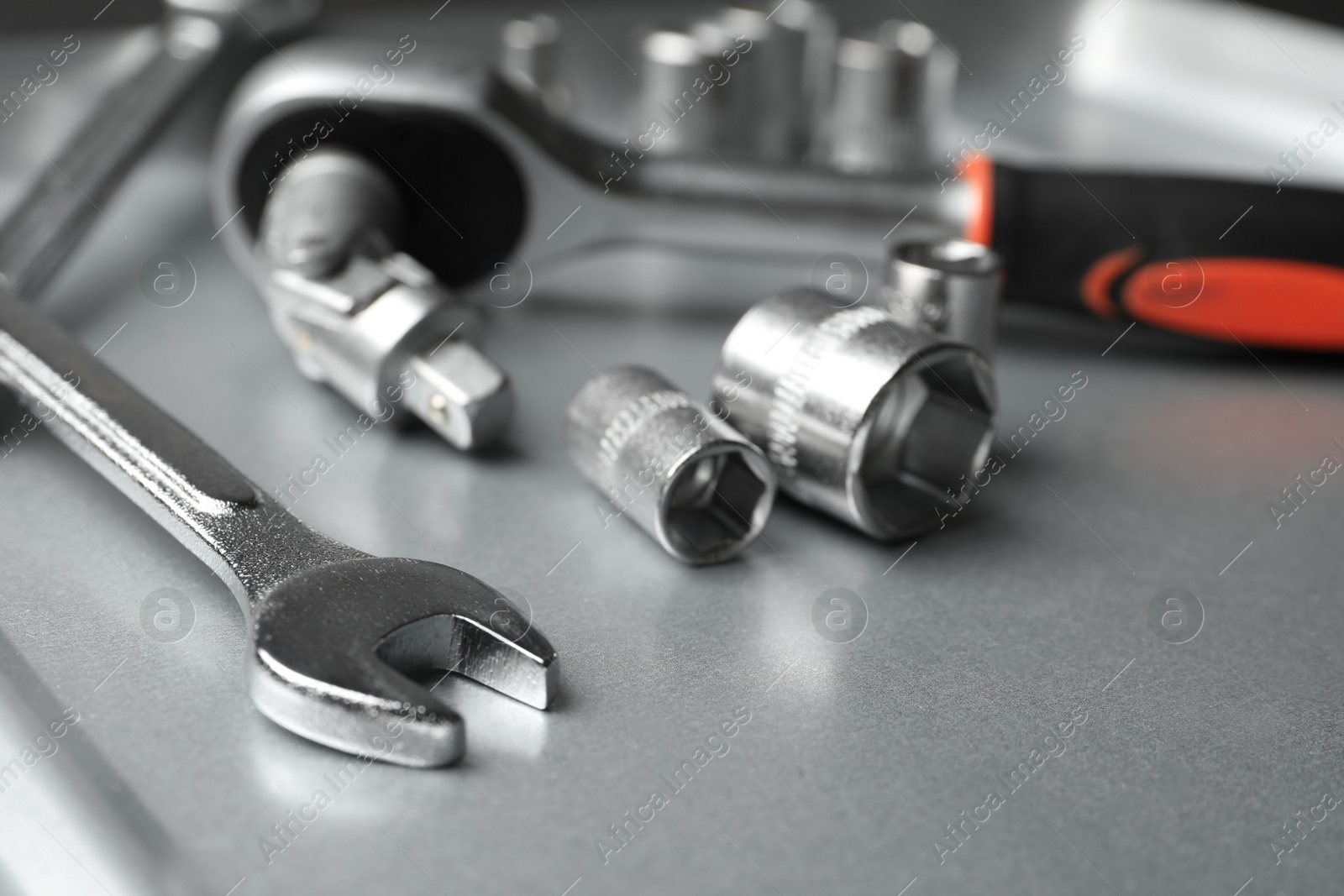 Photo of Auto mechanic's tools on metallic surface, closeup