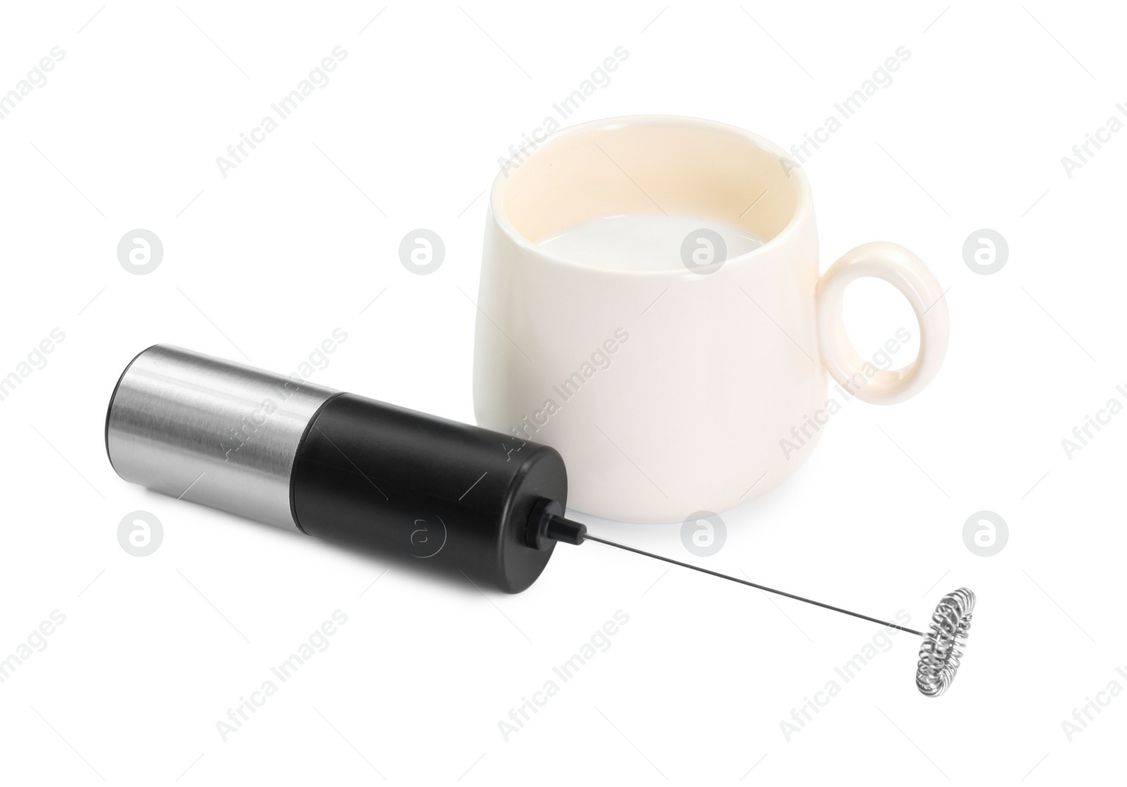 Photo of Milk frother wand and cup isolated on white