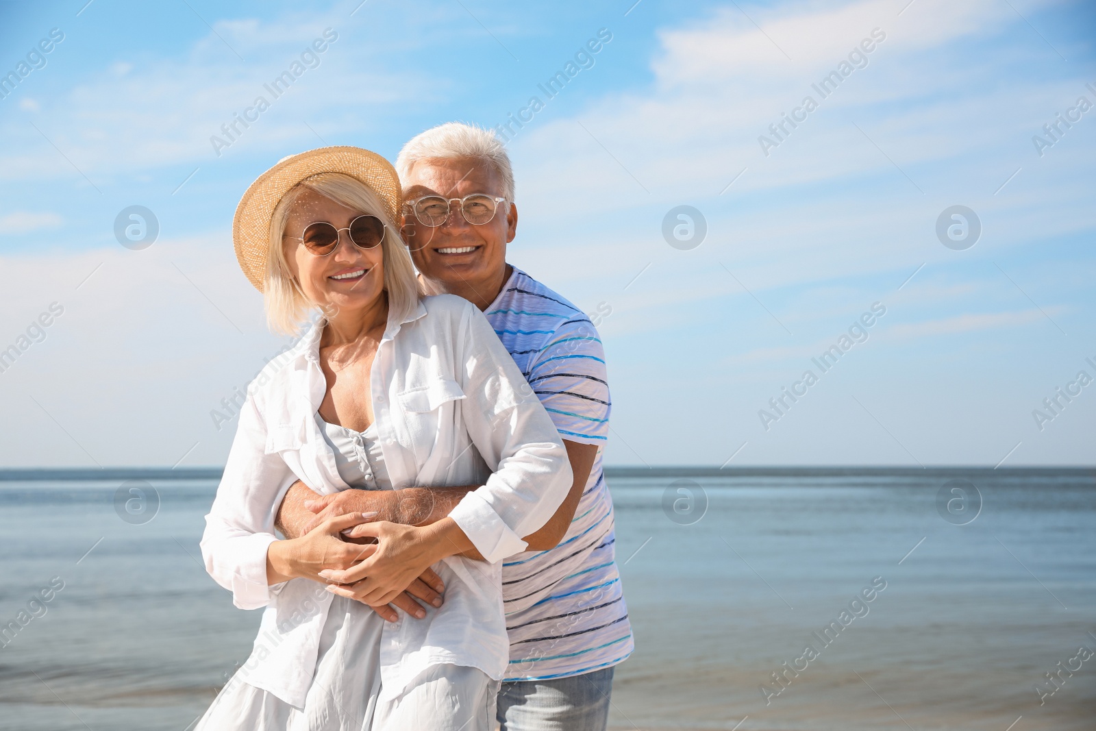 Photo of Mature couple spending time together on sea beach