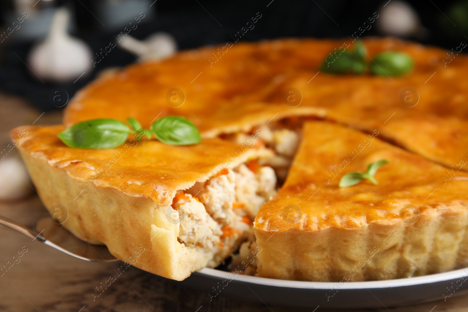 Photo of Delicious meat pie with basil on table, closeup