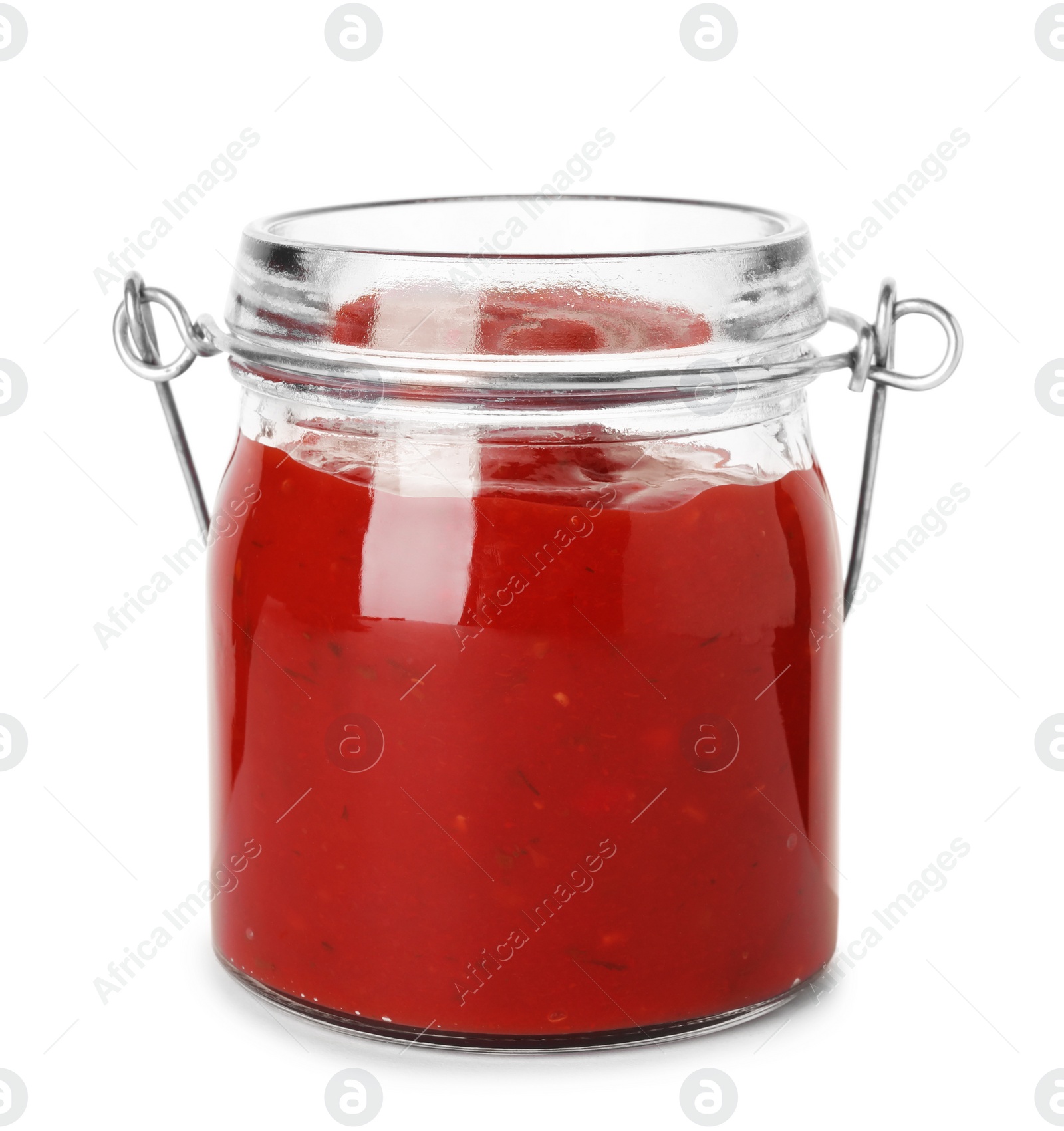 Photo of Glass jar with red sauce on white background