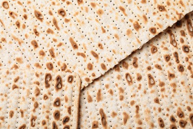 Photo of Traditional matzos as background, top view. Pesach celebration