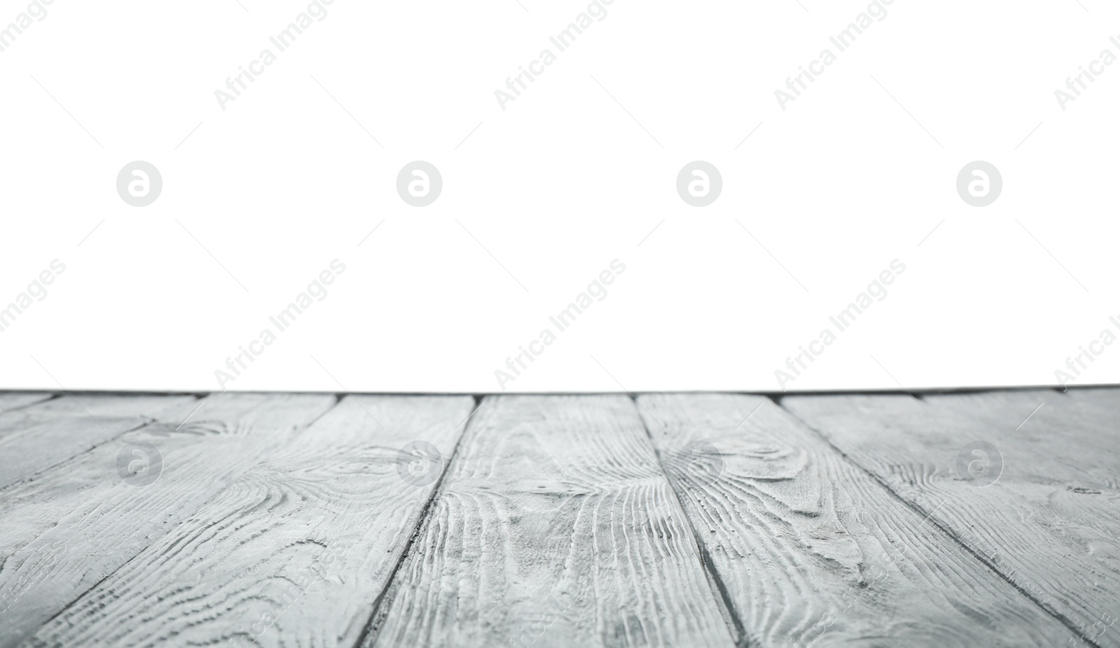 Photo of Empty wooden table surface on white background. Mockup for design