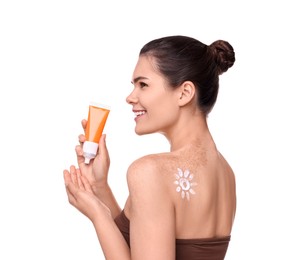 Beautiful young woman holding tube of sun protection cream against white background