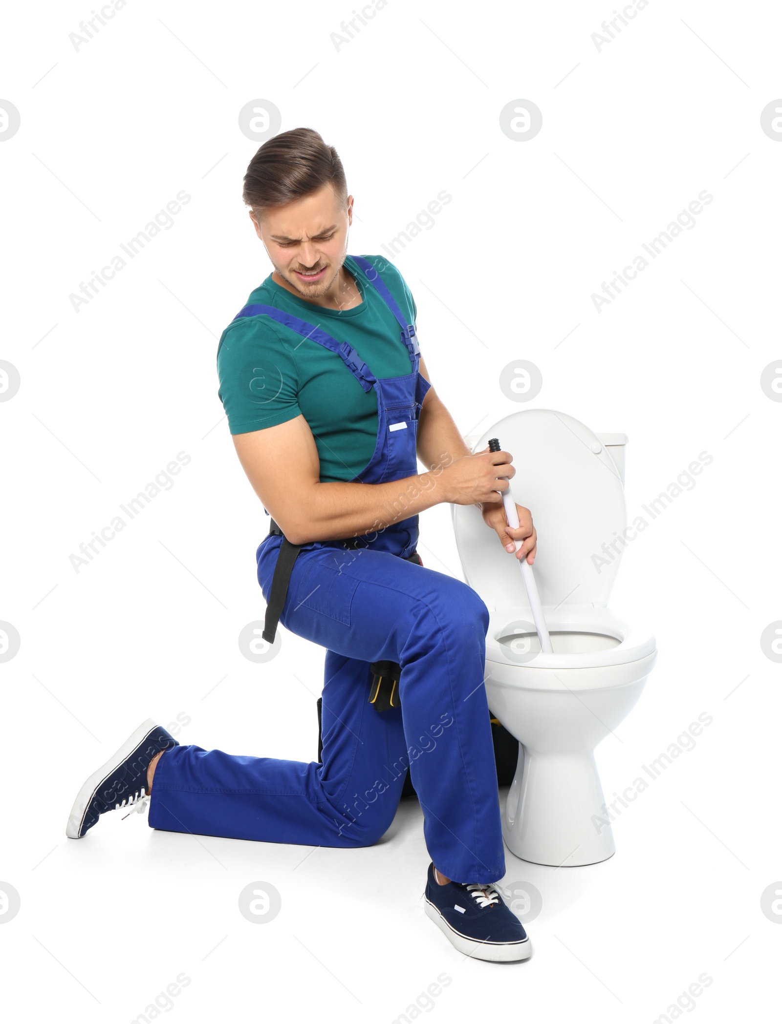 Photo of Young man working with toilet bowl, isolated on white