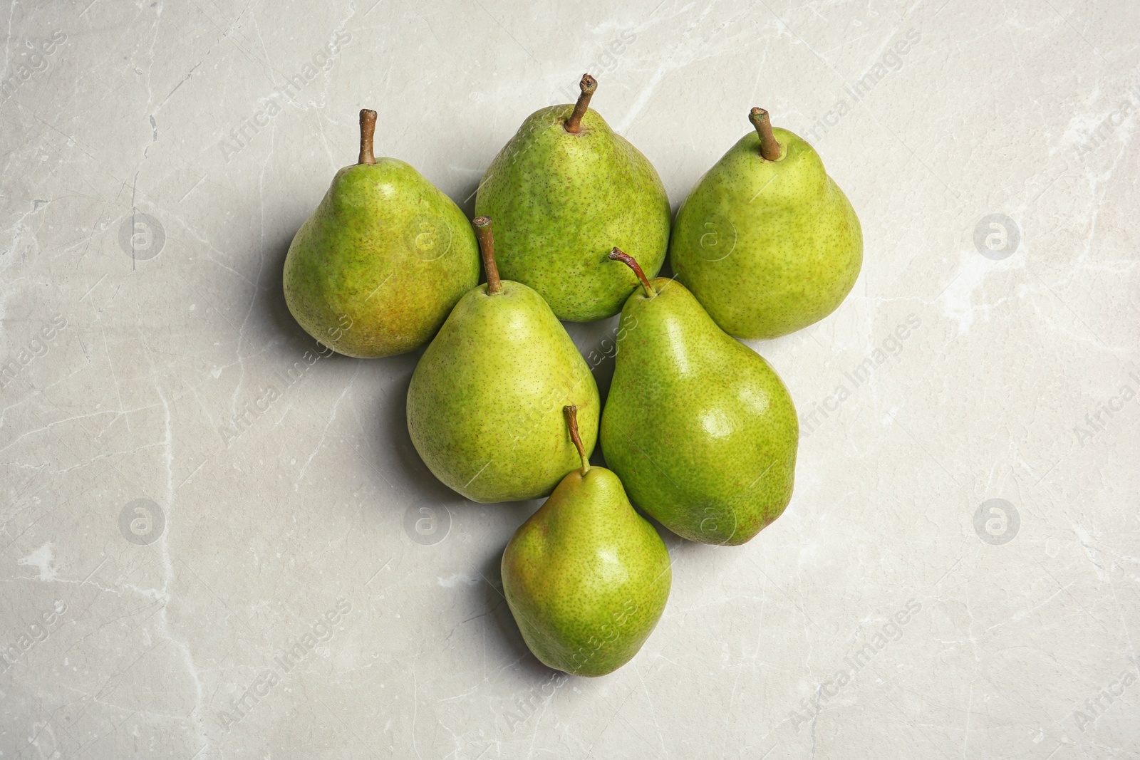 Photo of Ripe pears on grey background, top view