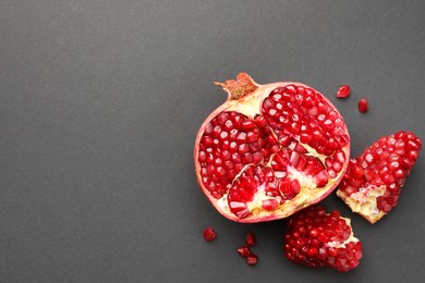 Fresh ripe pomegranate on grey background, top view. Space for text
