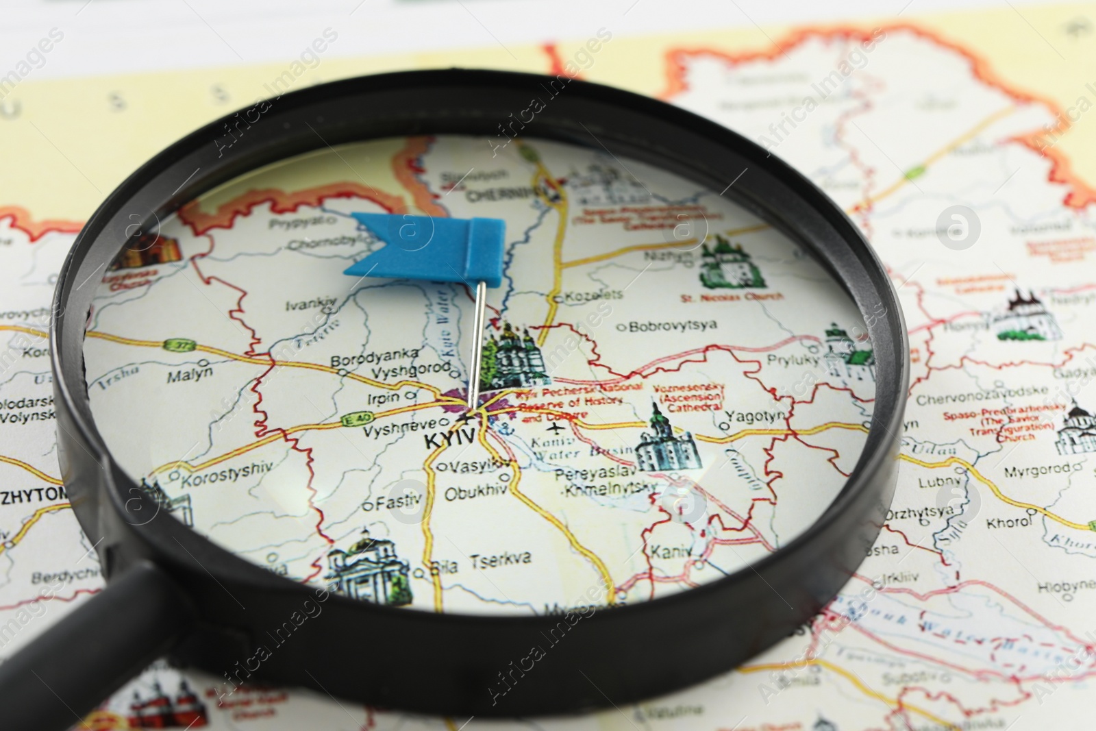 Photo of MYKOLAIV, UKRAINE - NOVEMBER 09, 2020: Magnifying glass on map of Ukraine with marked Kyiv city, closeup