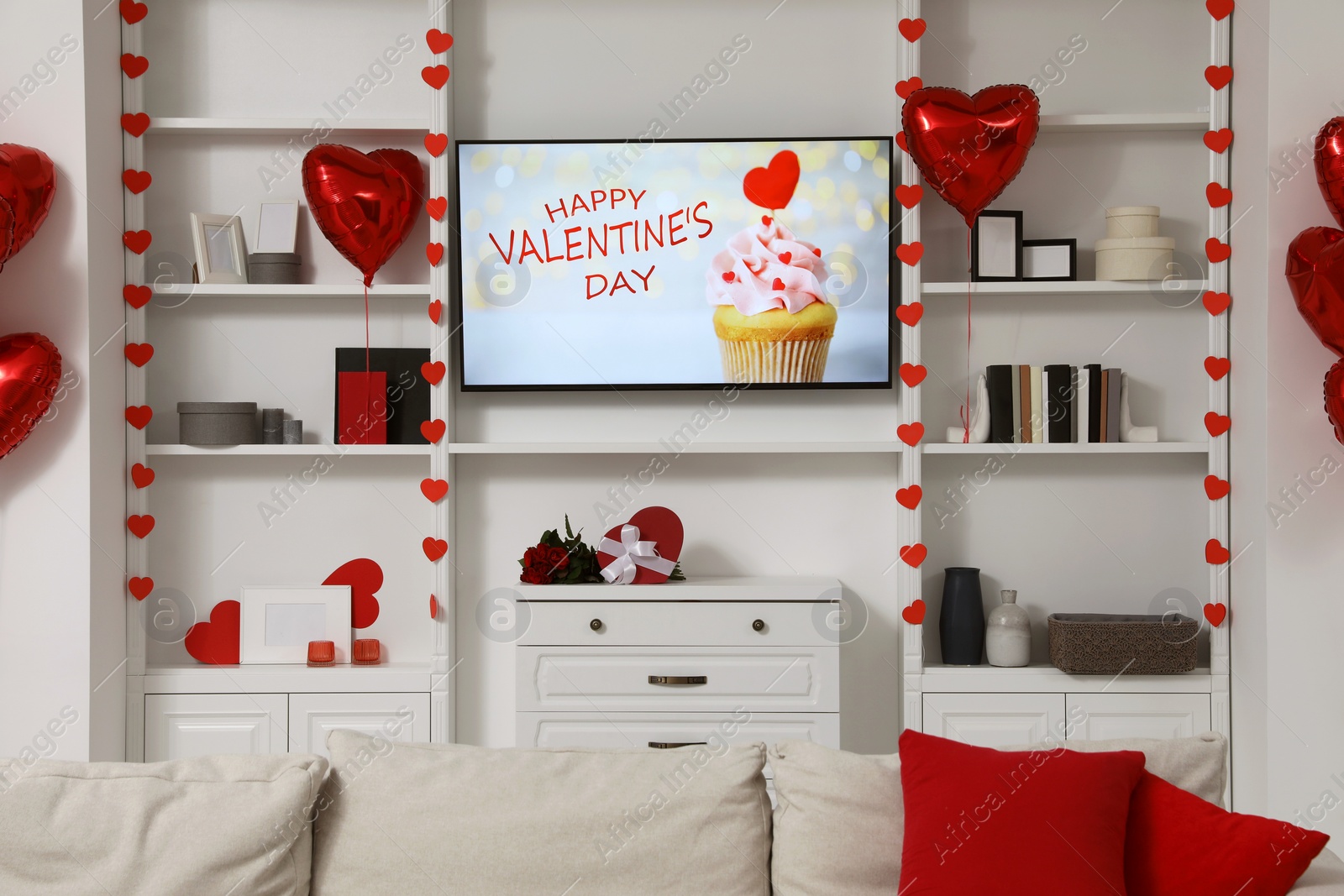 Photo of Cozy living room decorated for Valentine Day. Interior design