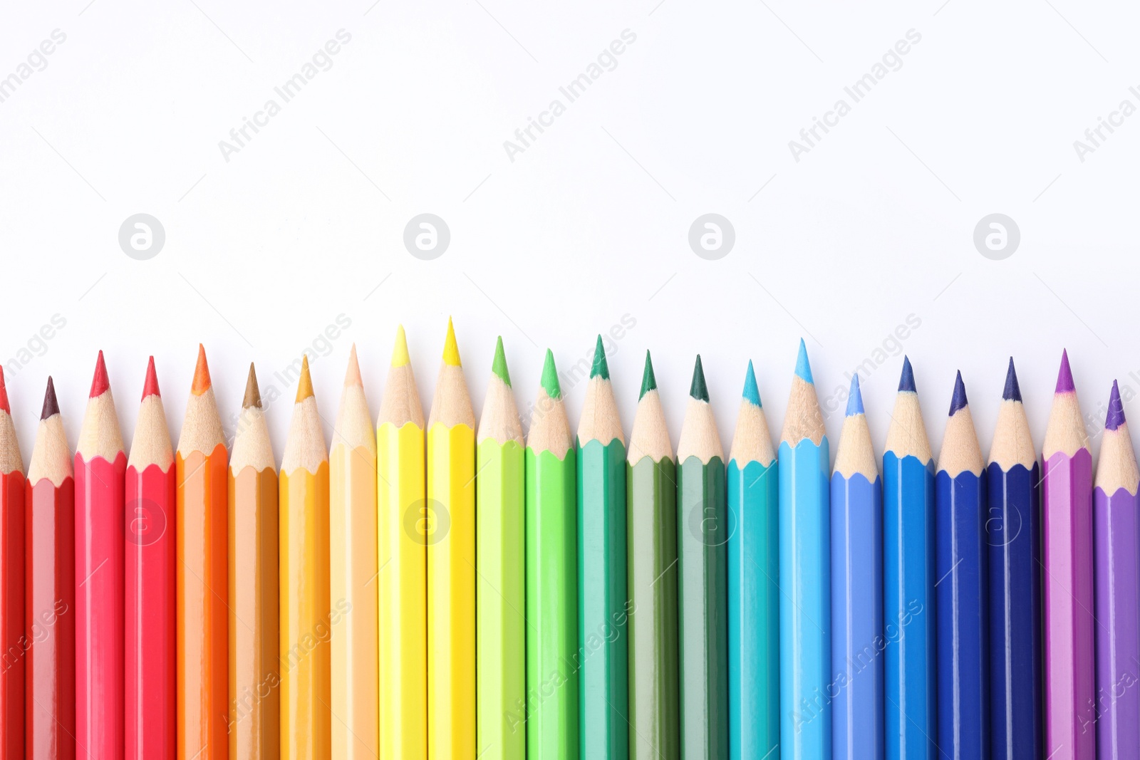 Photo of Many colorful wooden pencils on white background, flat lay. Space for text