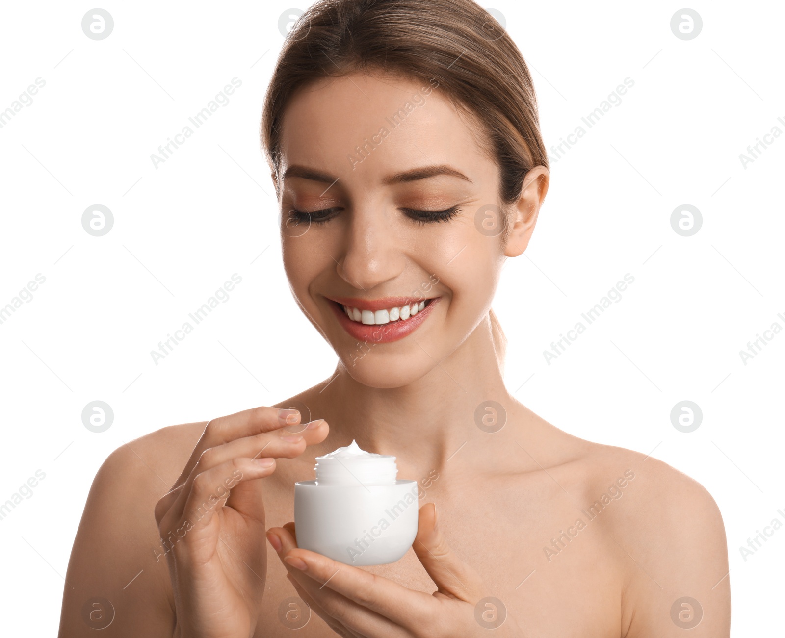 Photo of Young woman holding jar of facial cream on white background