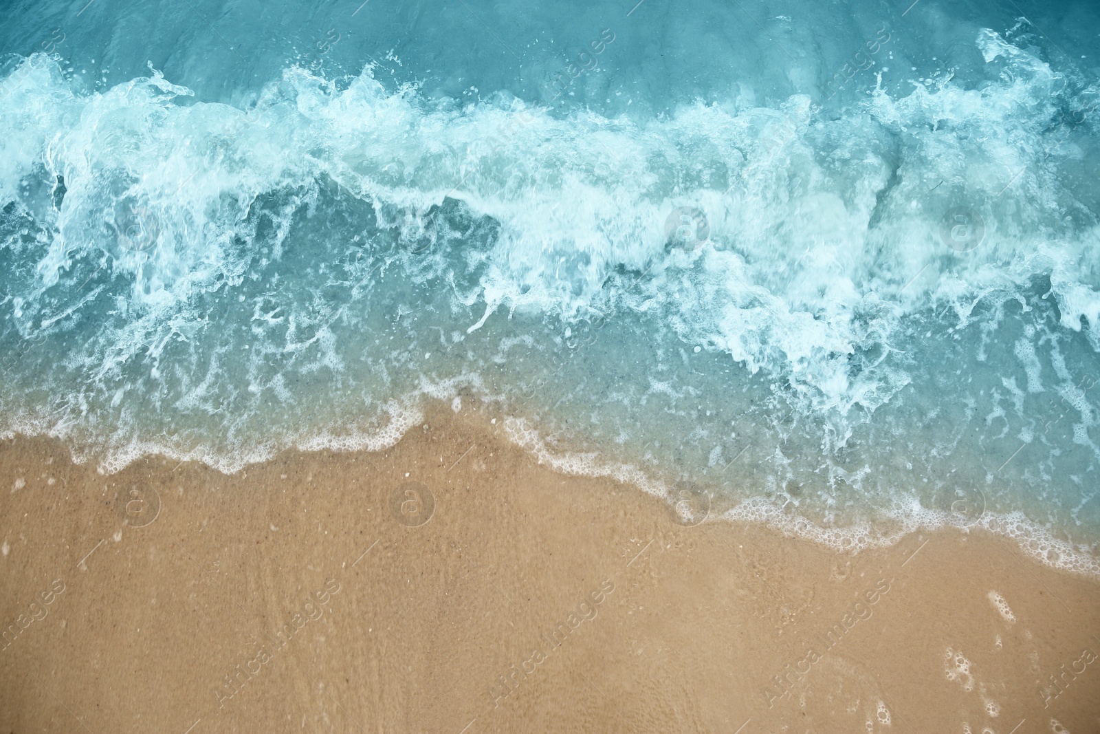 Photo of Beautiful view of sea tide on sandy beach. Summer vacation