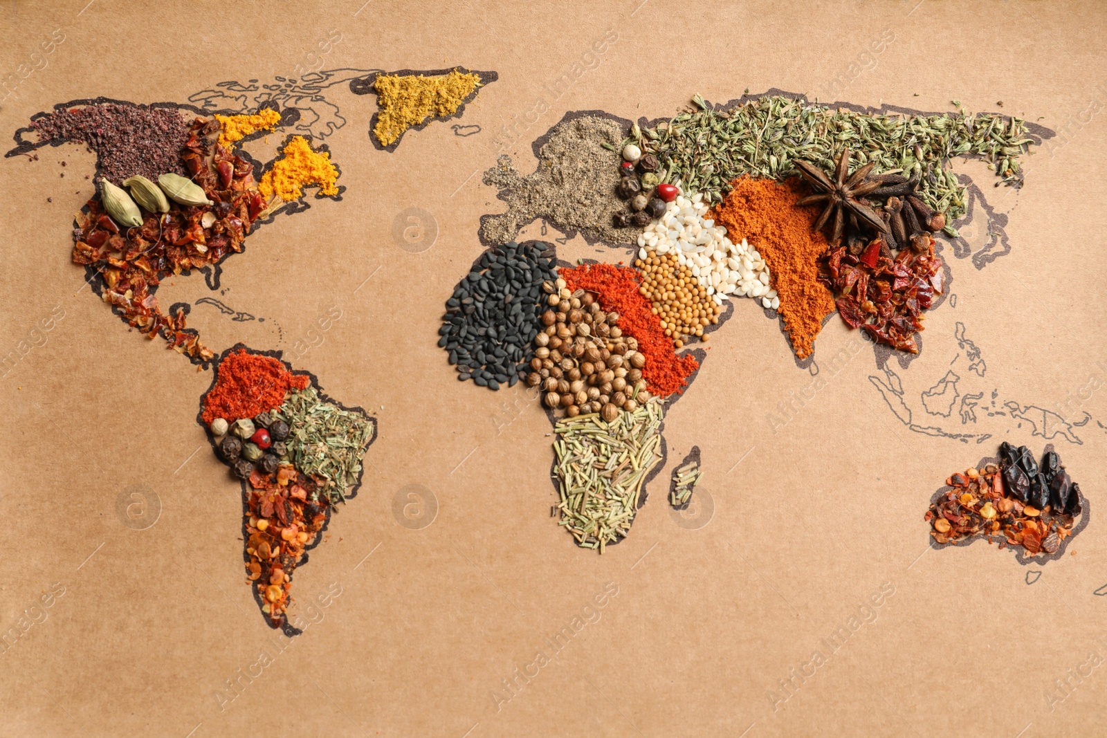 Photo of Paper with world map made of different aromatic spices as background, top view