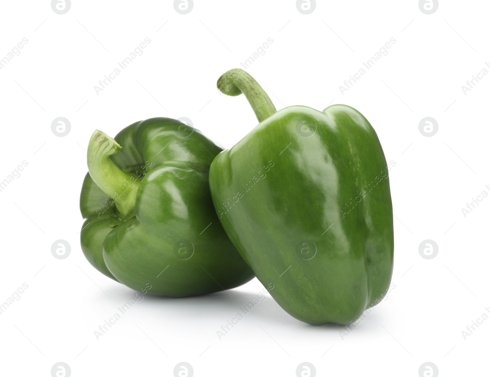 Photo of Ripe green bell peppers on white background