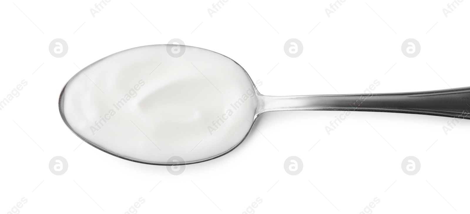 Photo of Delicious natural yogurt in spoon isolated on white, top view