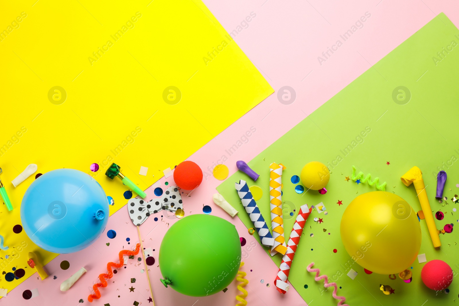 Photo of Flat lay composition with carnival items on color background. Space for text
