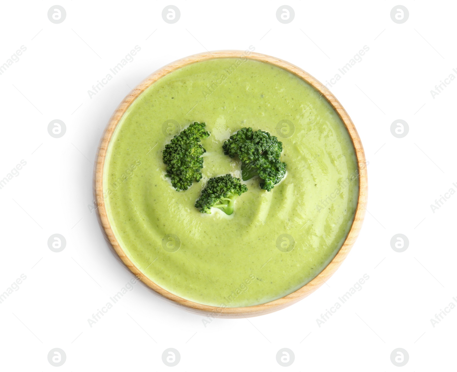 Photo of Delicious broccoli cream soup isolated on white, top view