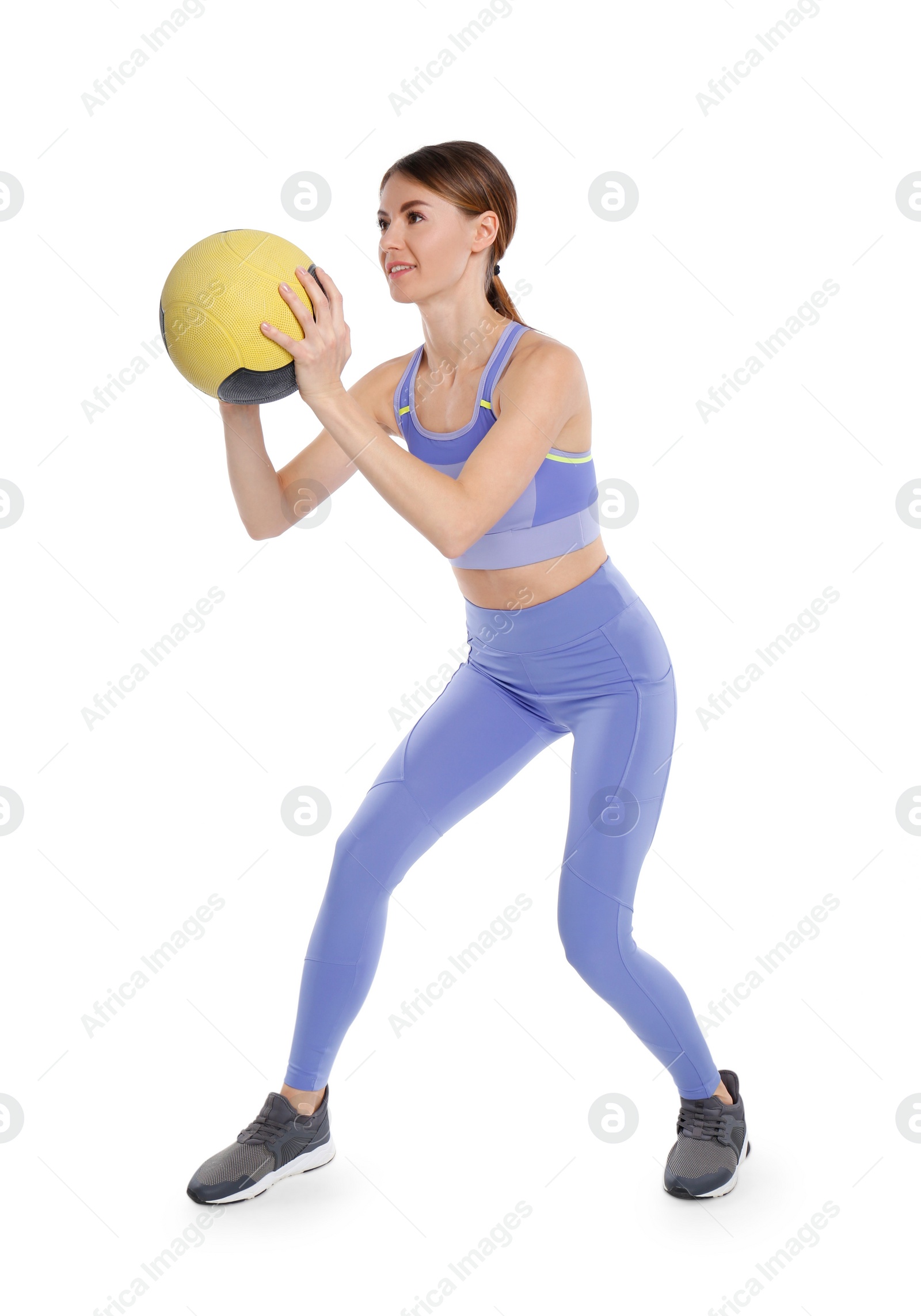 Photo of Athletic woman doing exercise with medicine ball isolated on white