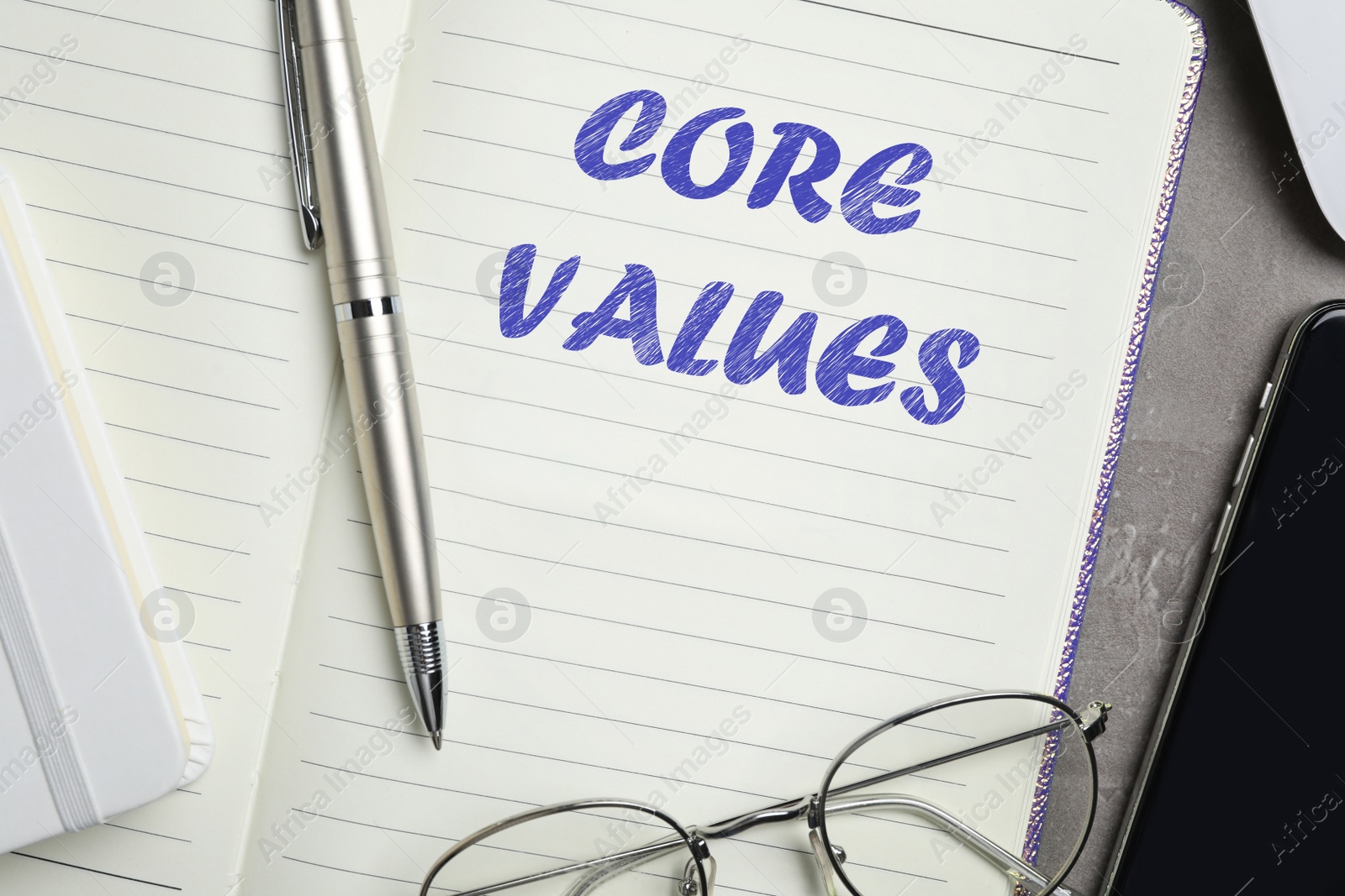 Image of Core values concept. Flat lay composition with stationery on dark table 
