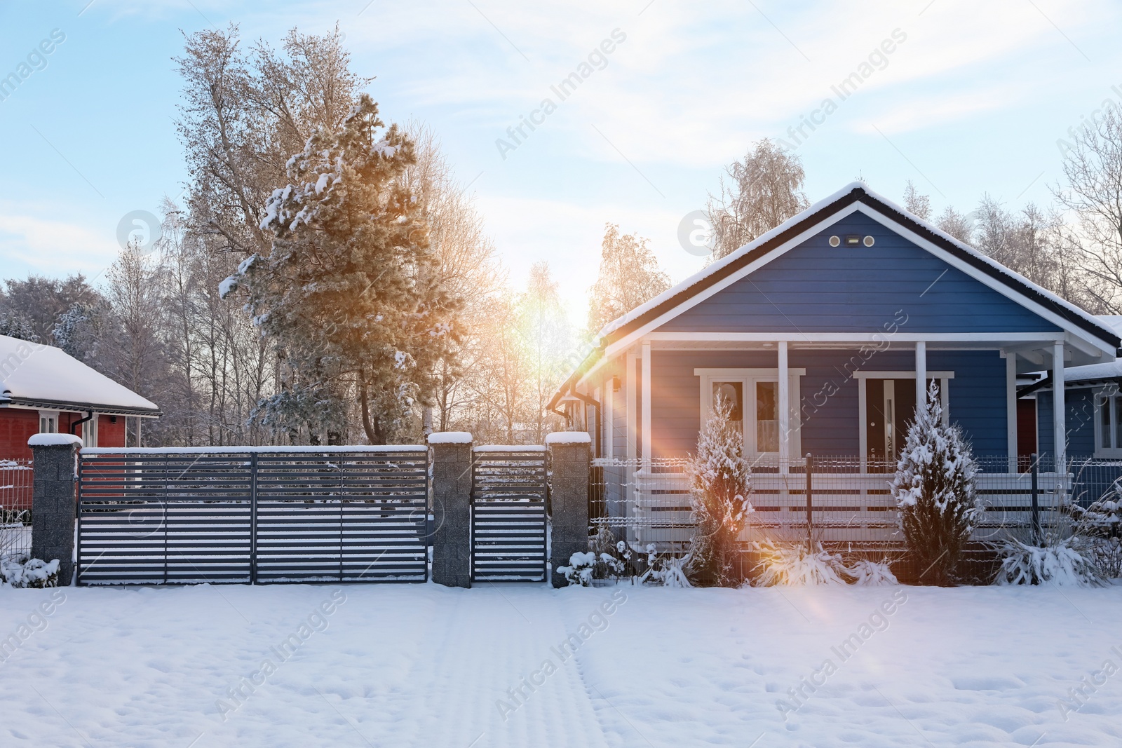 Photo of Winter landscape with beautiful houses, trees and bushes in morning